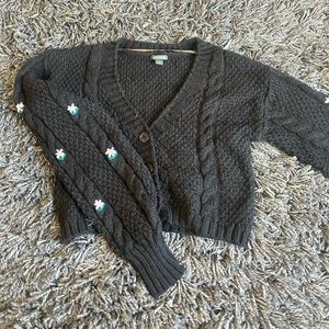 black sweater with embroidered flowers